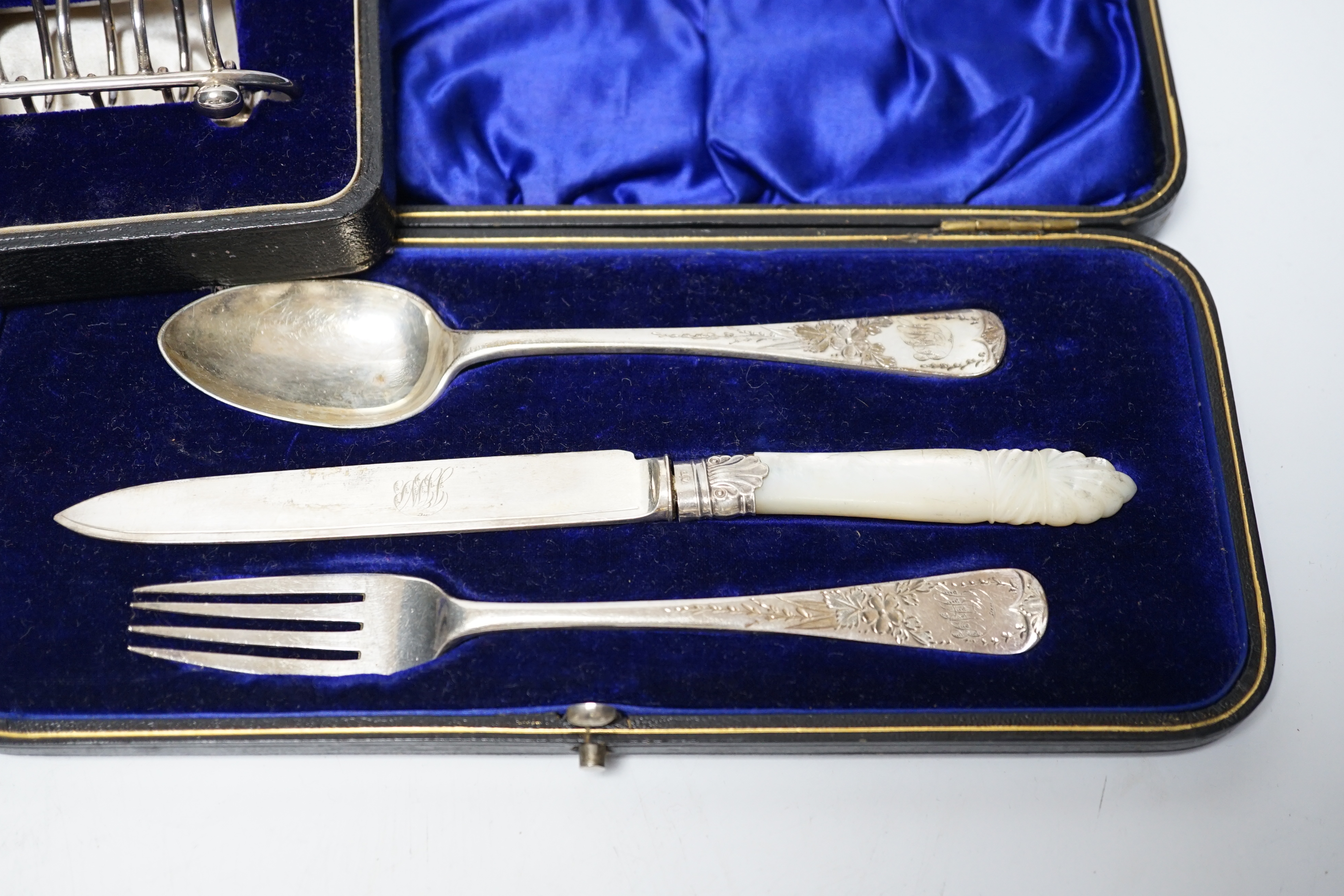 Thirteen assorted cased silver sets, including two sets of six handled tea knives, Leicester and Pudsey replica spoons, two matched sets of napkin rings, single spoon, christening trio, two sets of teaspoons, pair of toa